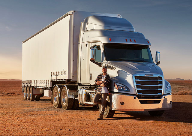 Truck Finance for trucking start ups, man standing in front of truck comparing rates from over 80 lenders